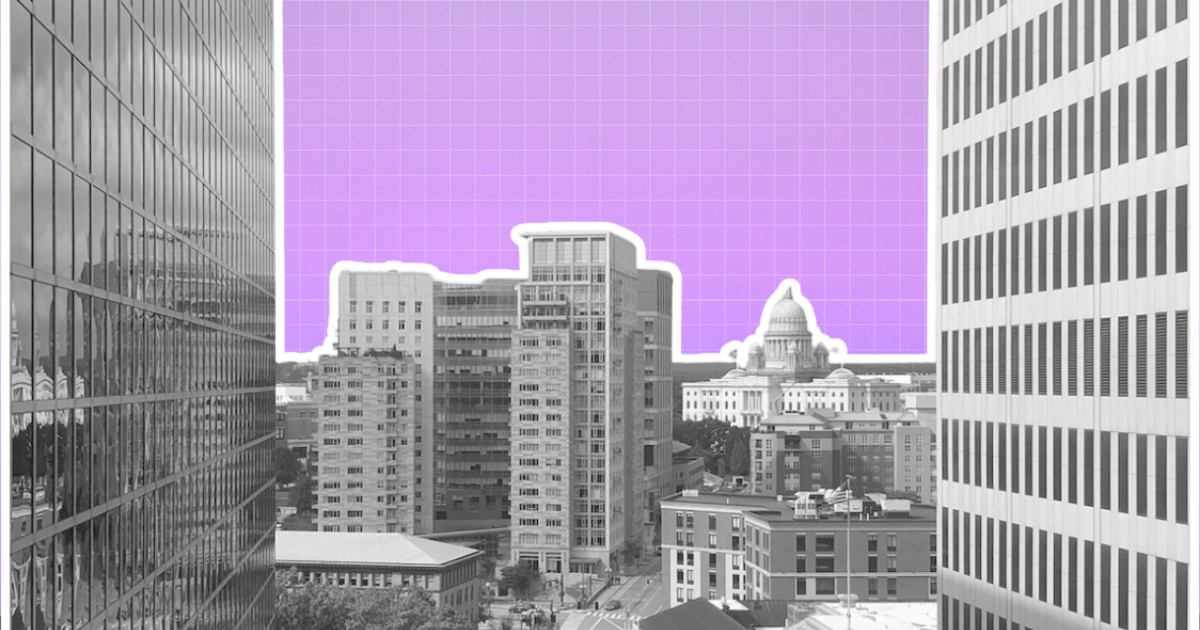 Cityscape with tall buildings, domed structure, and a purple grid sky. Featured on real estate site for 2024 industrial market article.