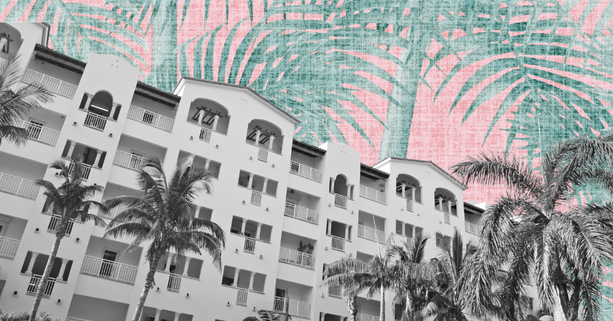 Monochrome building with balconies and tall palm trees against a surreal pink and green palm frond sky.