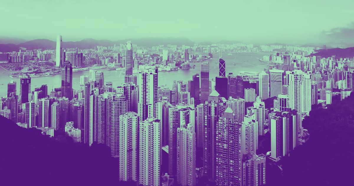 Stylized cityscape with skyscrapers, waterway, and hills under a purple-teal sky for a real estate article on Blackstone's BREIT.