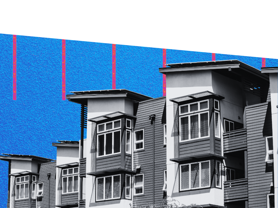 Modern apartment building with gray and white paneling, large windows, angular roofs; image for article on US low occupancy rates.