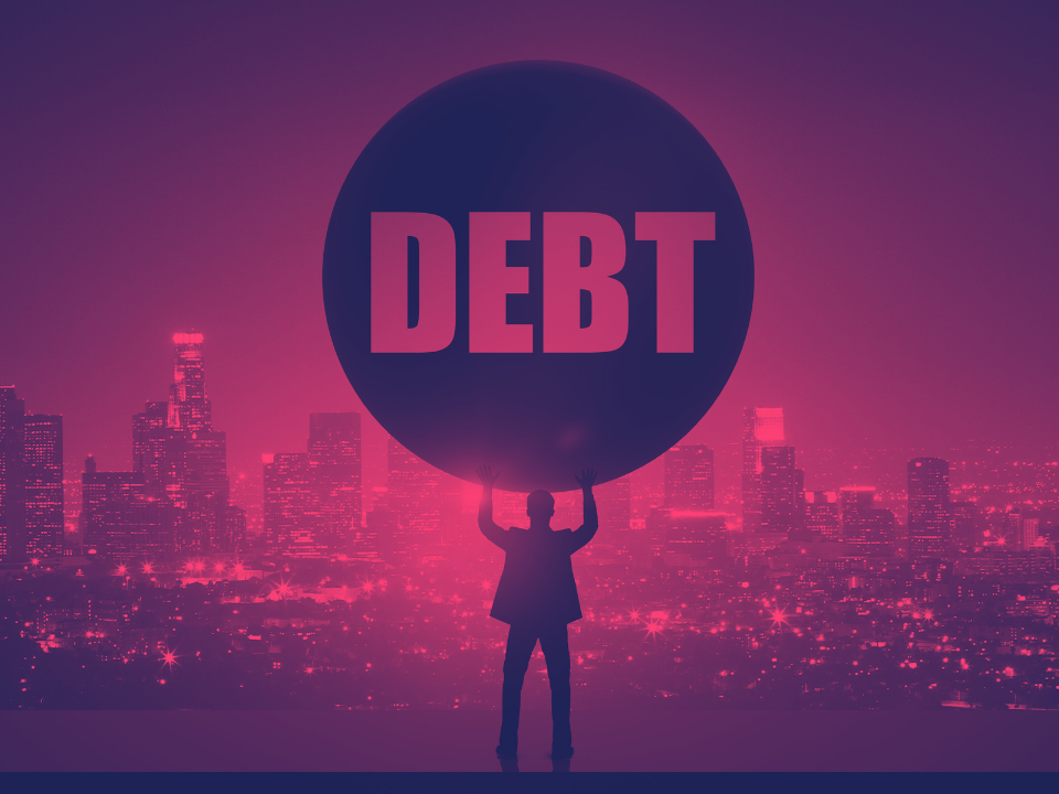 Silhouette of a person holding a "DEBT" sphere against a pink-purple city skyline; for an article on rising commercial mortgage debt.