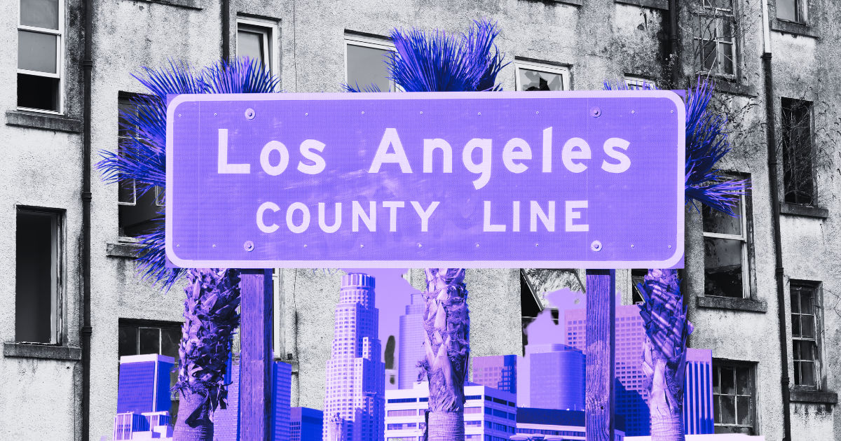 Stylized L.A. County Line sign with palm trees and a purple-black skyline, evoking a vibrant urban vibe for a real estate site.