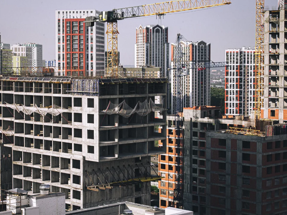 Carlyle Fund hits $9B, targeting residential and industrial assets while avoiding office and retail sectors.