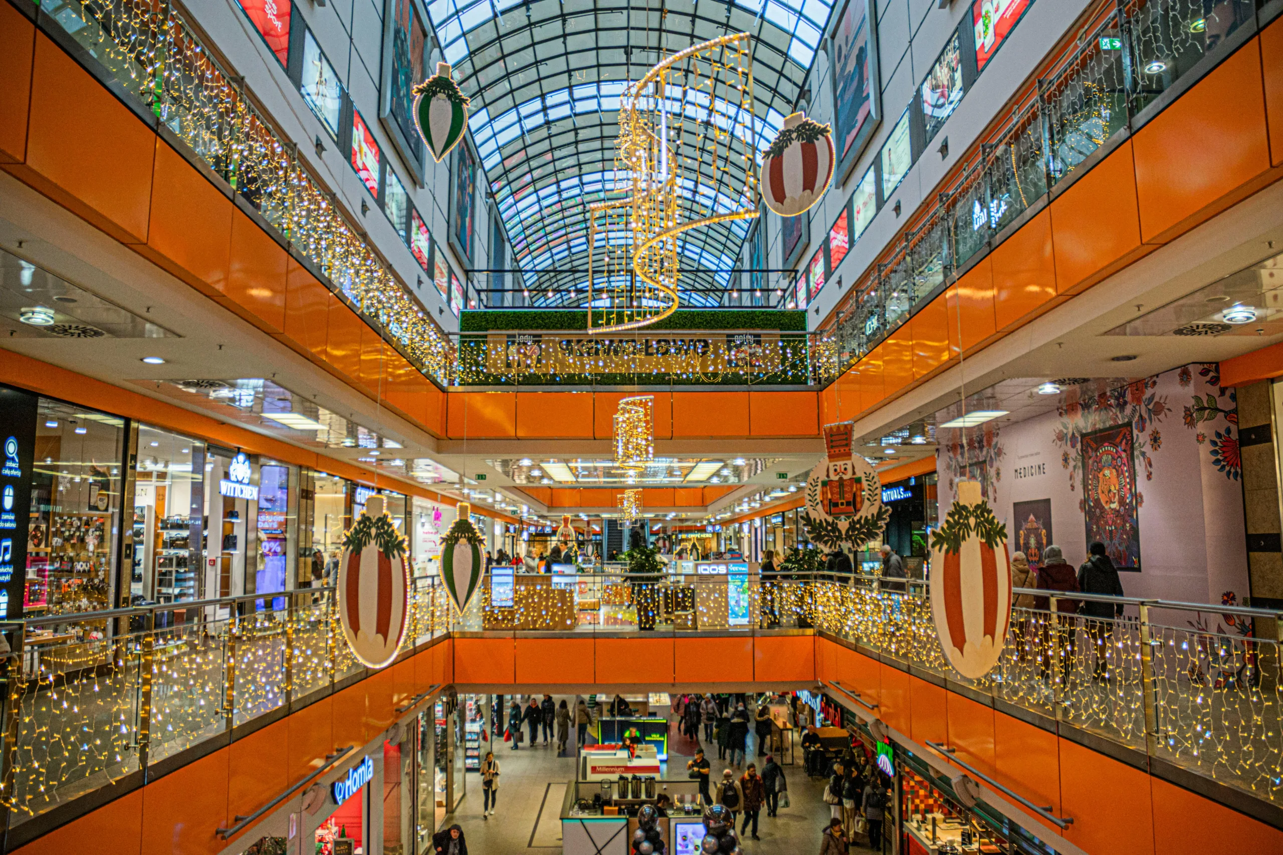 Holiday retail starts early as economic uncertainty splits consumers between luxury spending and deep discount hunting.