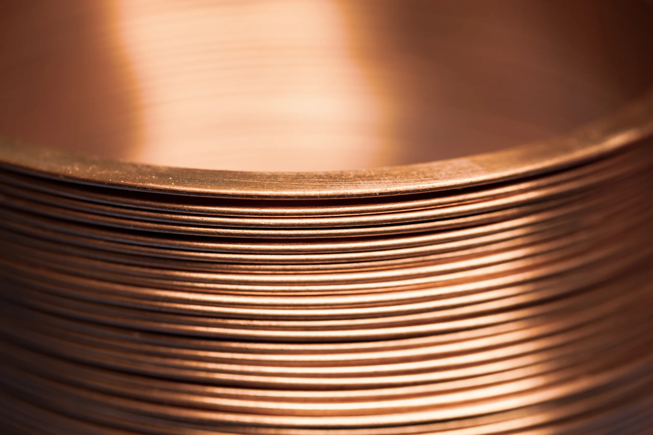 Copper prices surge to decade highs as US builders face tariffs. Copper costs impact construction across data centers and commercial sectors.