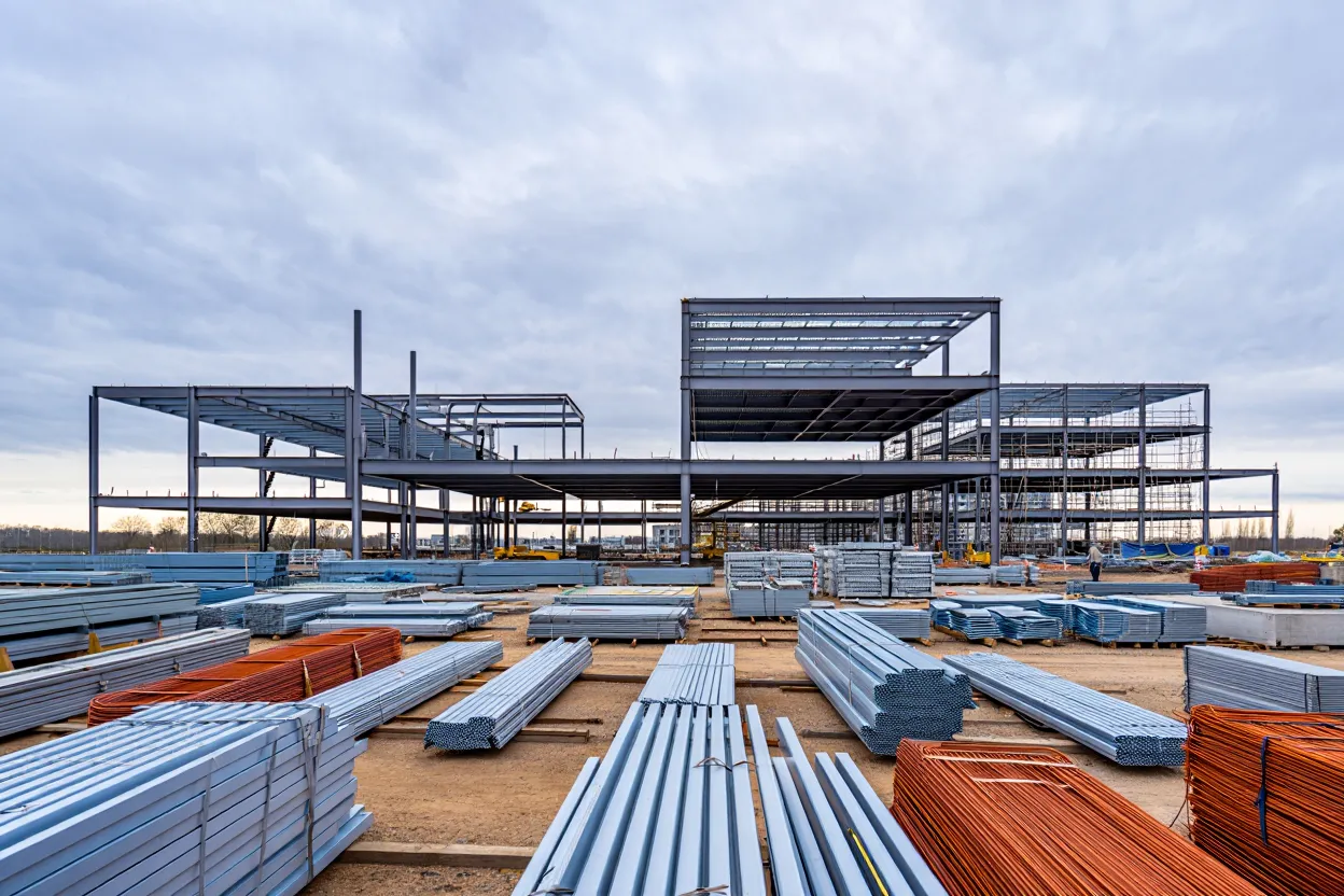 Construction backlog hits a four-year low as material costs surge and new project starts decline, with notable regional and sector shifts.