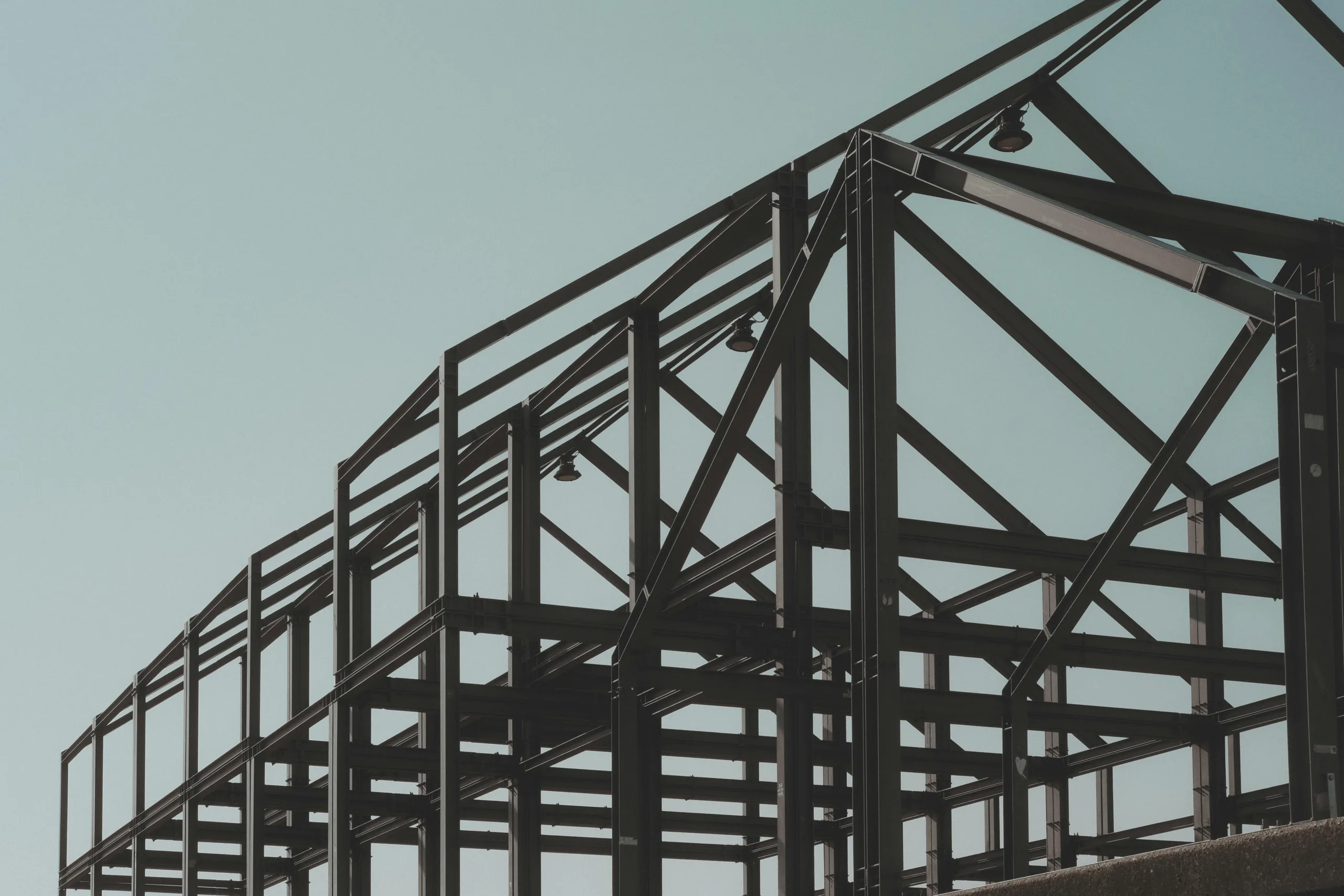 Construction material costs rose 6.2% through April as energy, steel, and lumber prices climbed, pressuring CRE projects.
