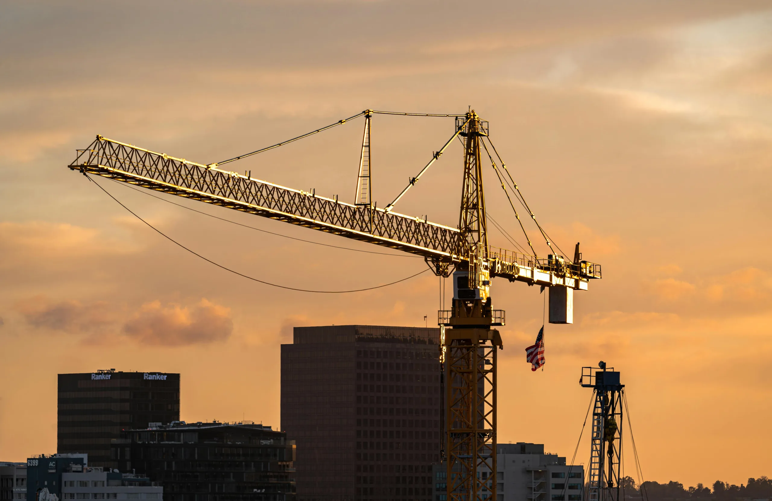 Los Angeles’ mansion tax is slowing multifamily development as apartment permits fall and developers rethink new housing projects.