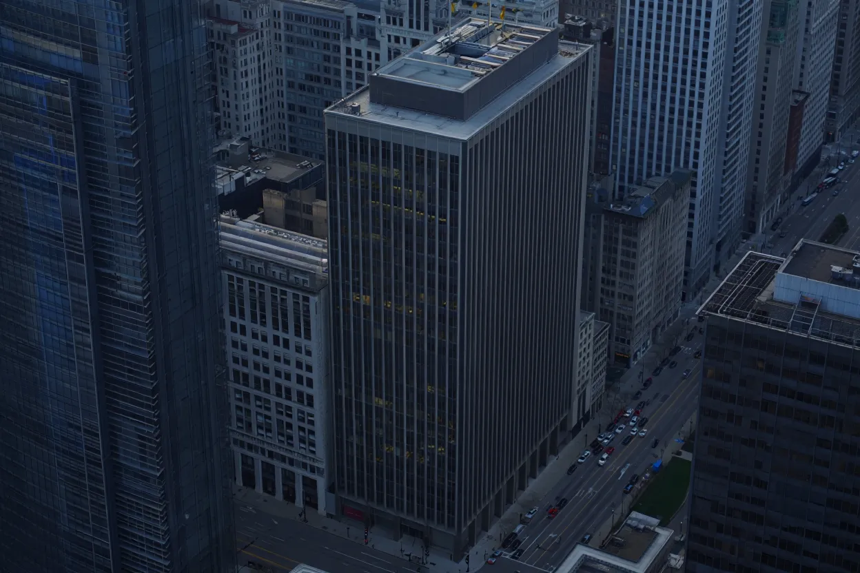 Blackstone has defaulted on a $343M loan for a Chicago office tower, underscoring stress in a market with 27% downtown vacancy, per CBRE.